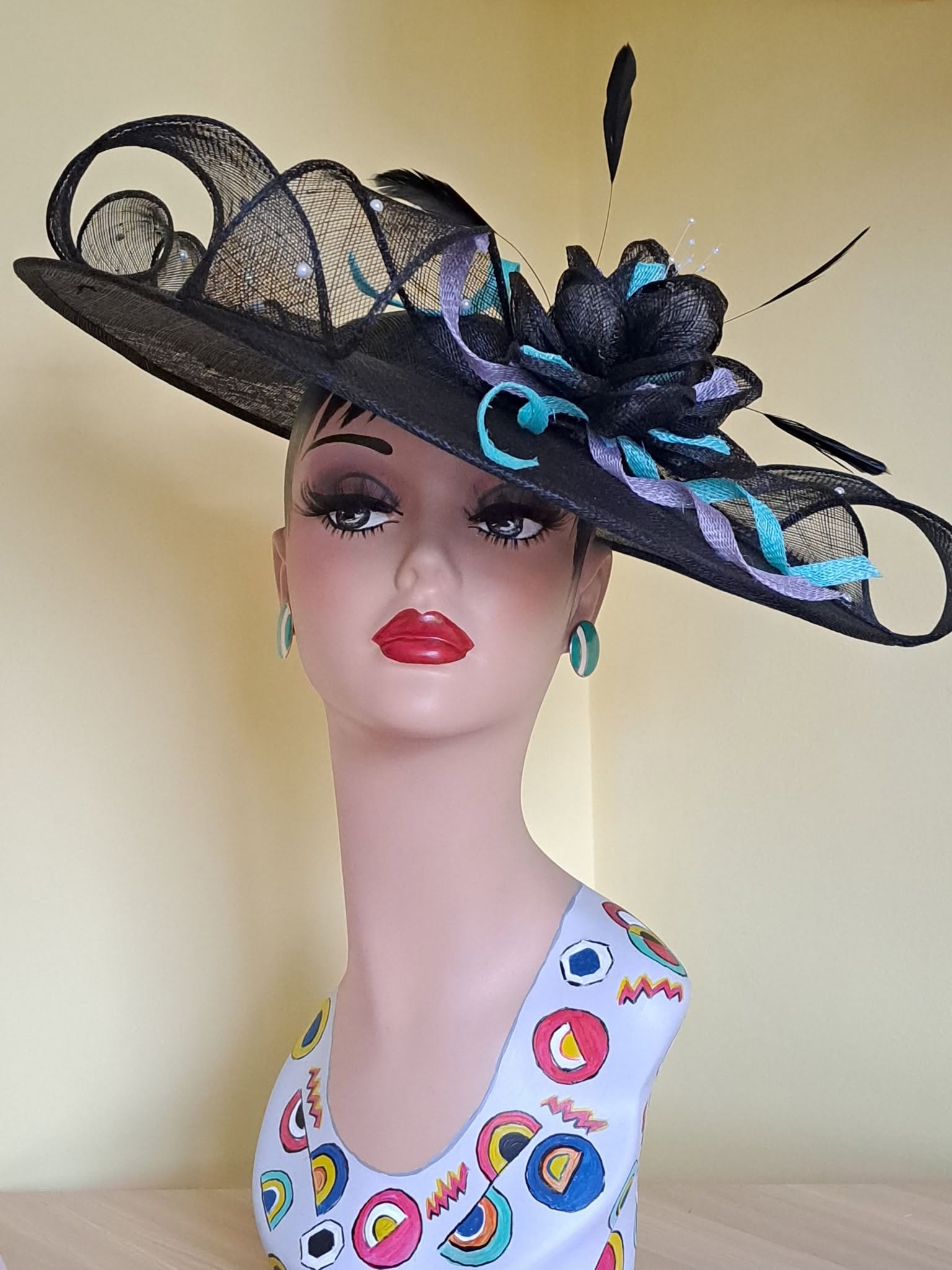 Black fascinator with turquoise and purple accents