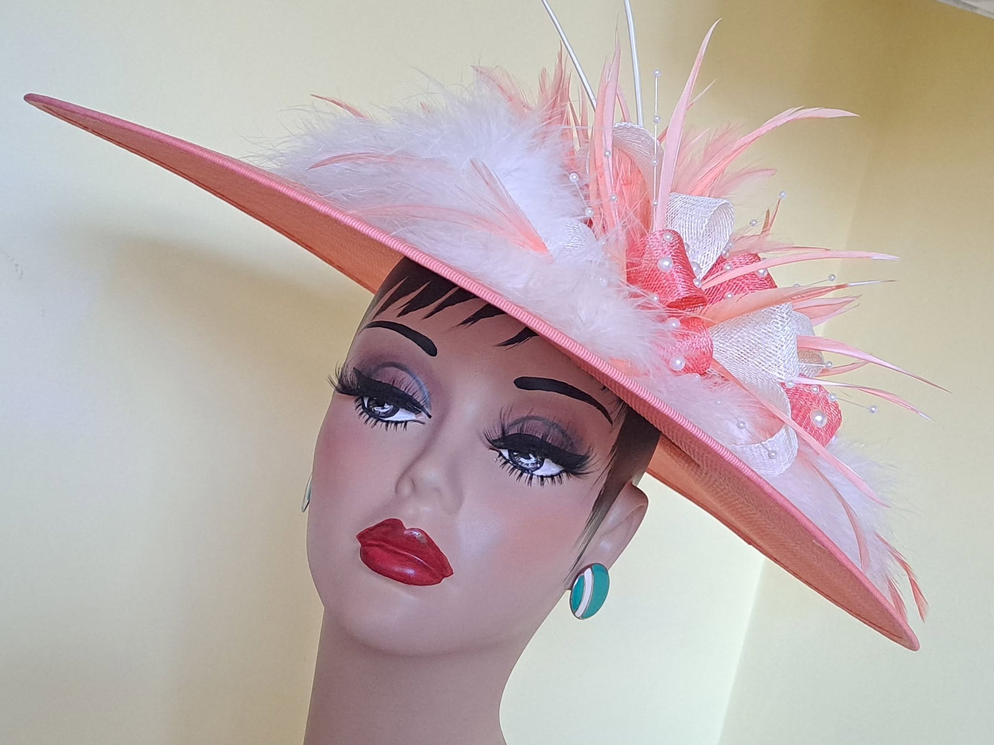 Pink feathered fascinator hat