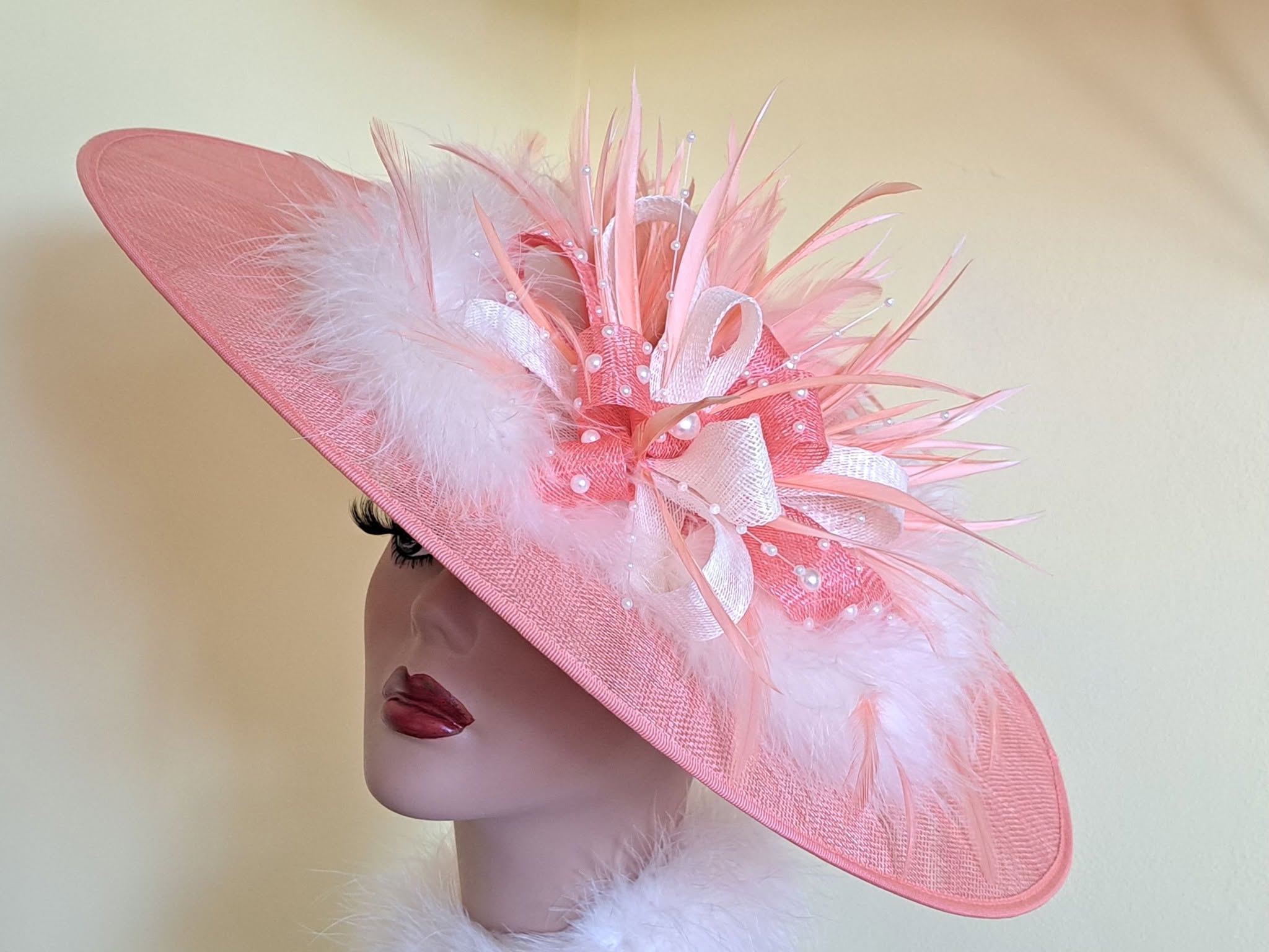 Pink fascinator with feathers and beaded embellishment
