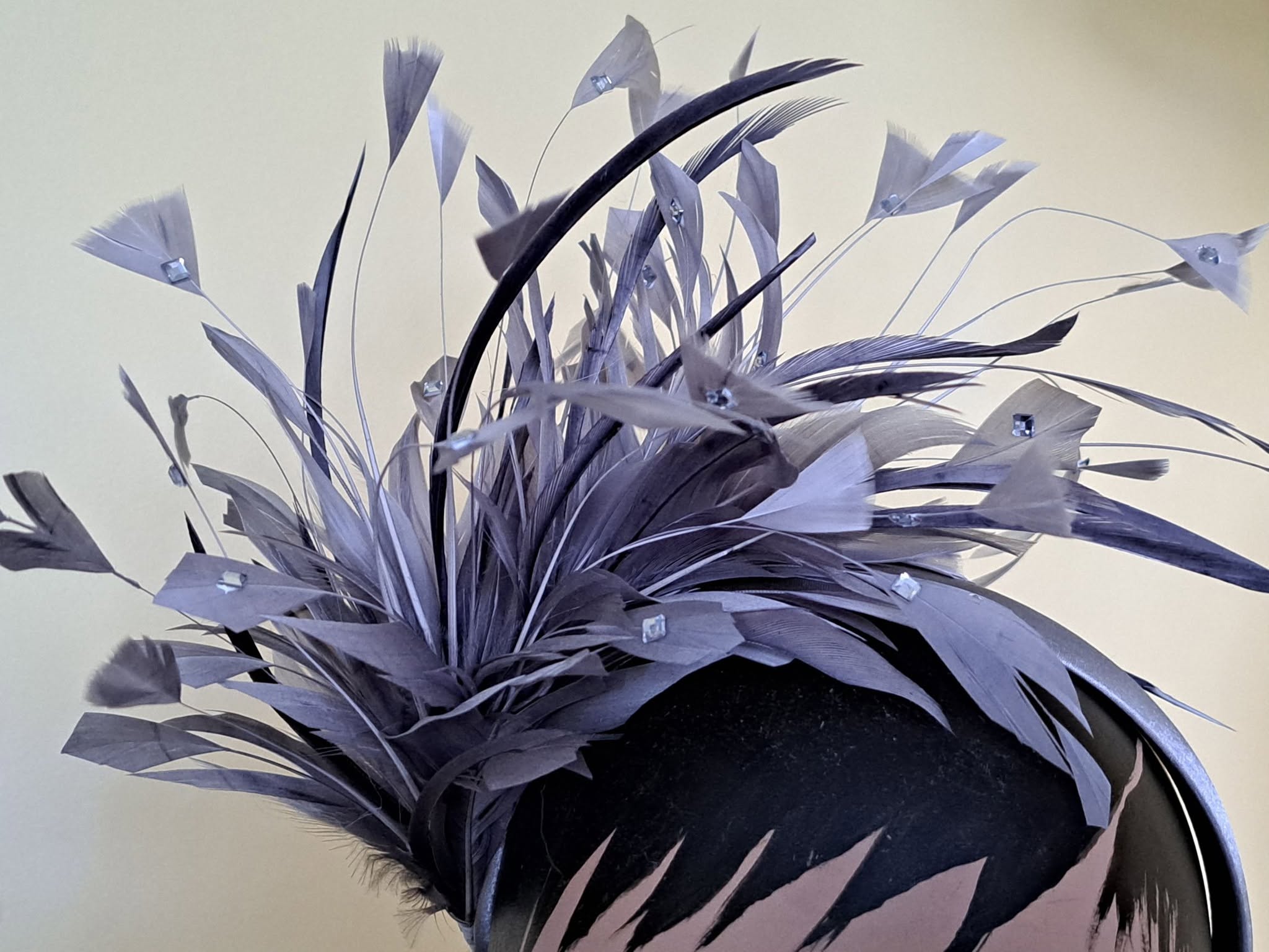 Purple feathered fascinator hat