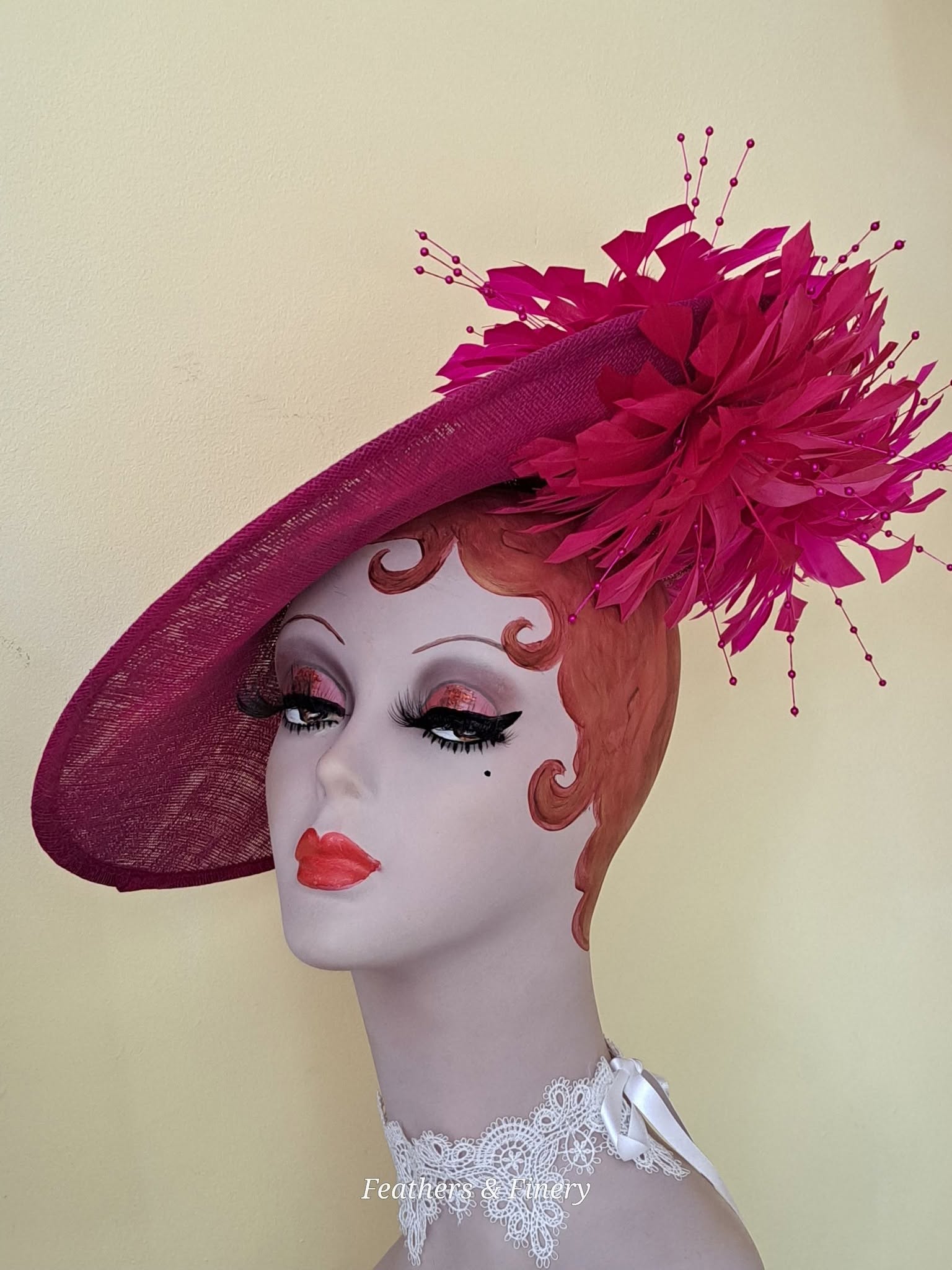 Magenta feathered fascinator hat