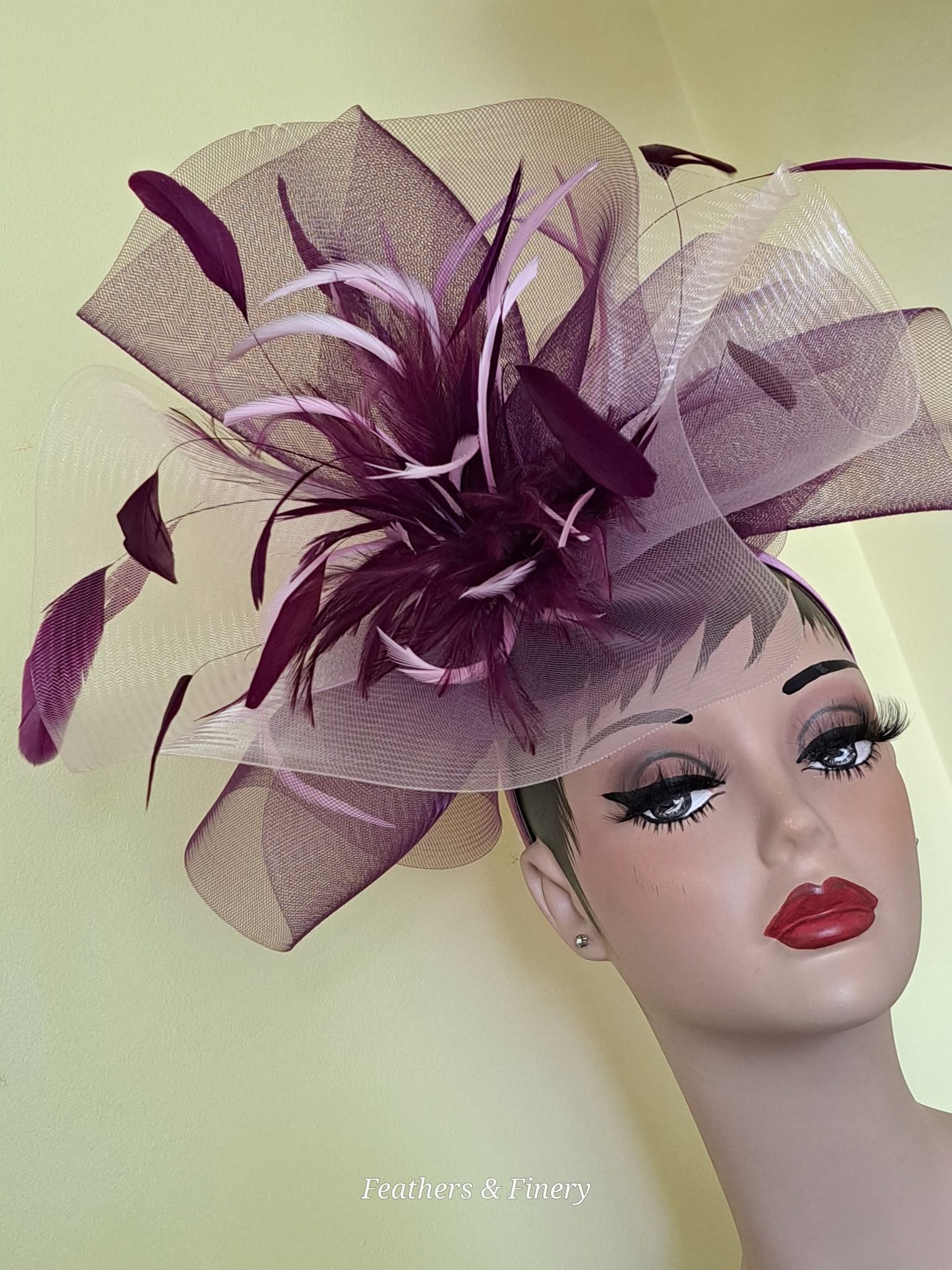 Purple fascinator with feathers and mesh detail