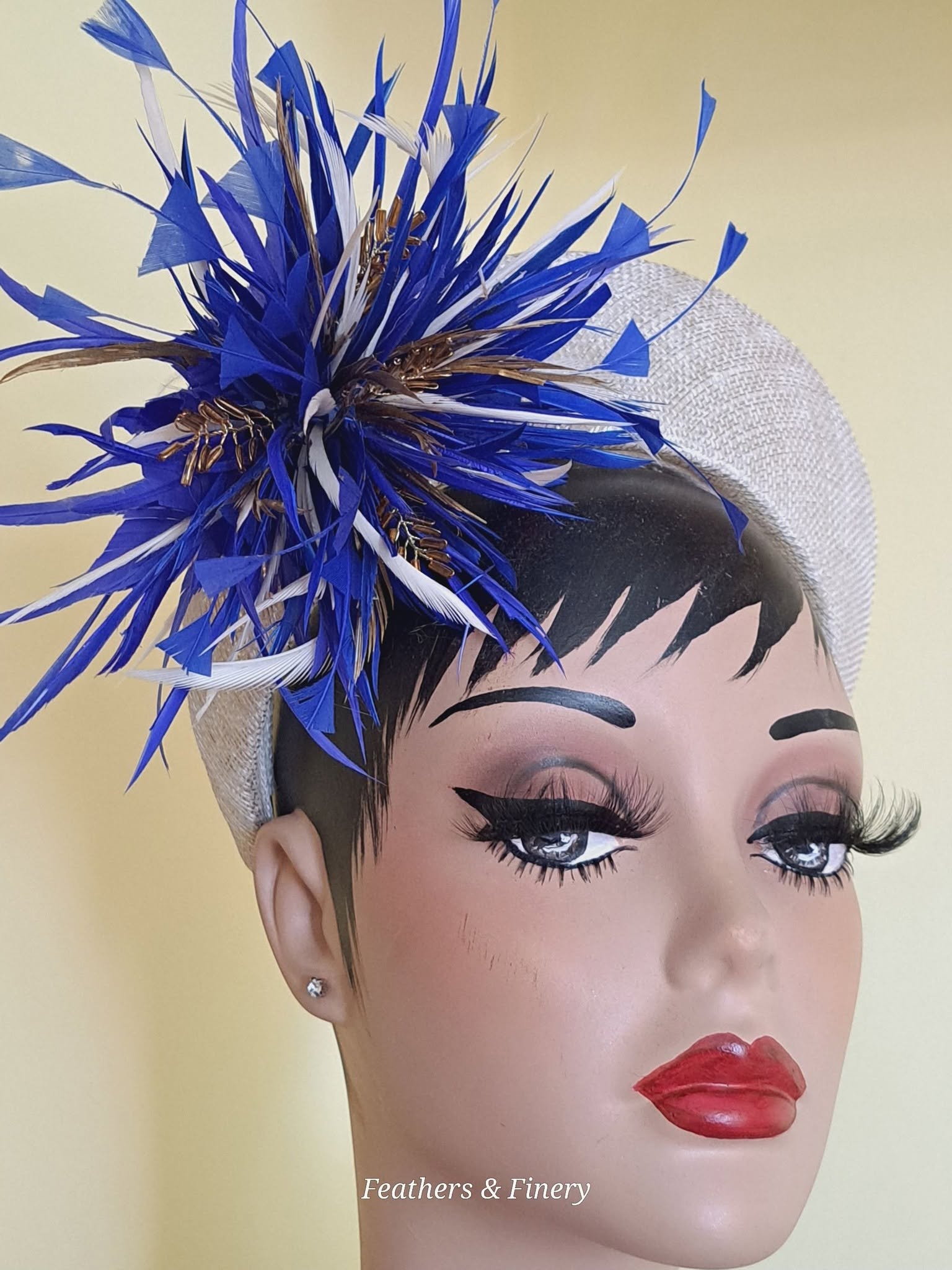 Blue feathered fascinator hat