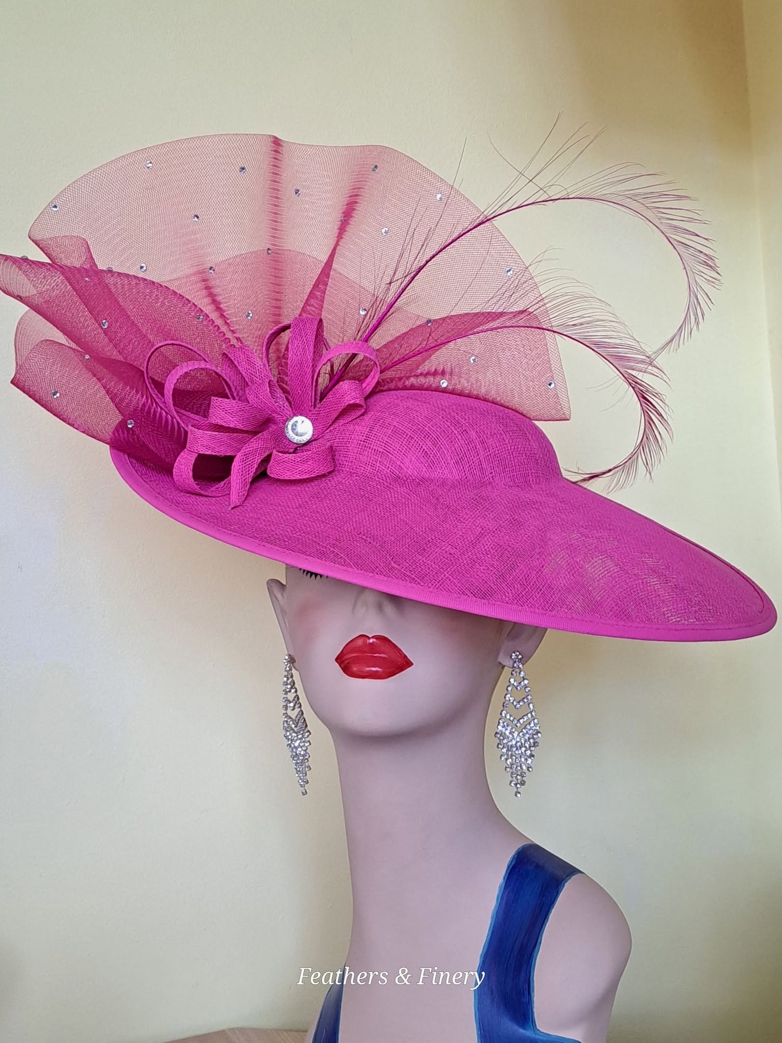 Fuchsia fascinator with feathers and embellishments