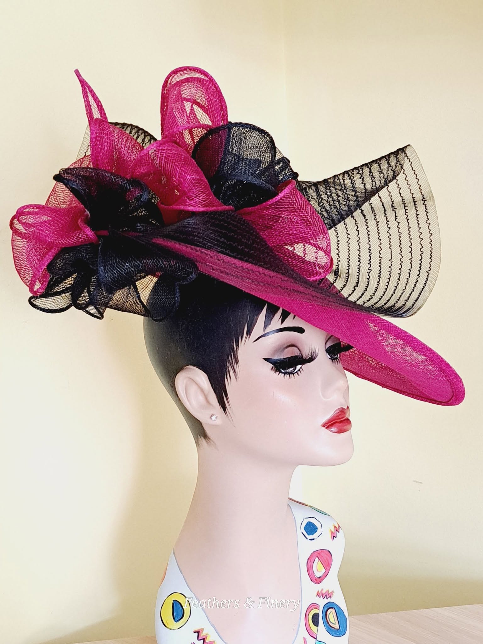 Pink and black fascinator hat