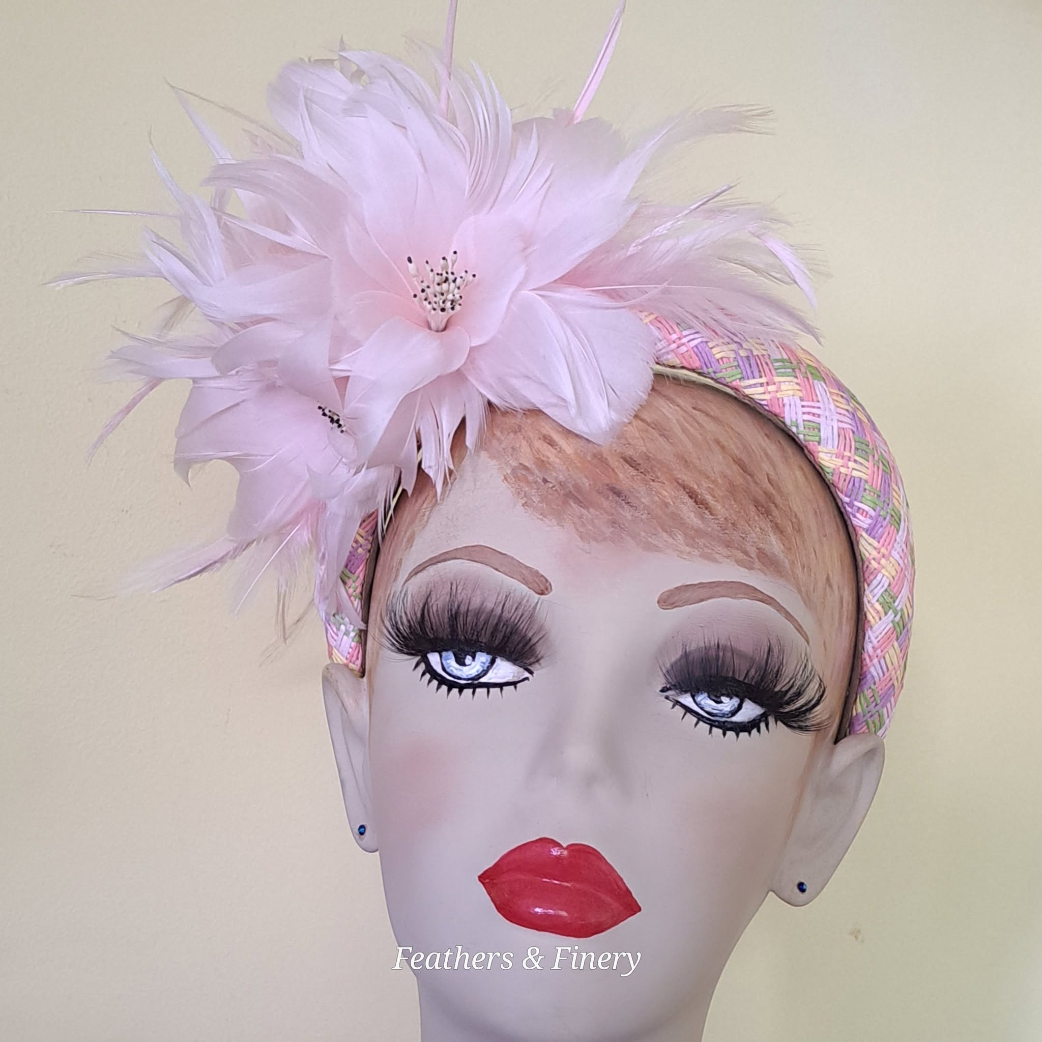 Pink feathered fascinator hat
