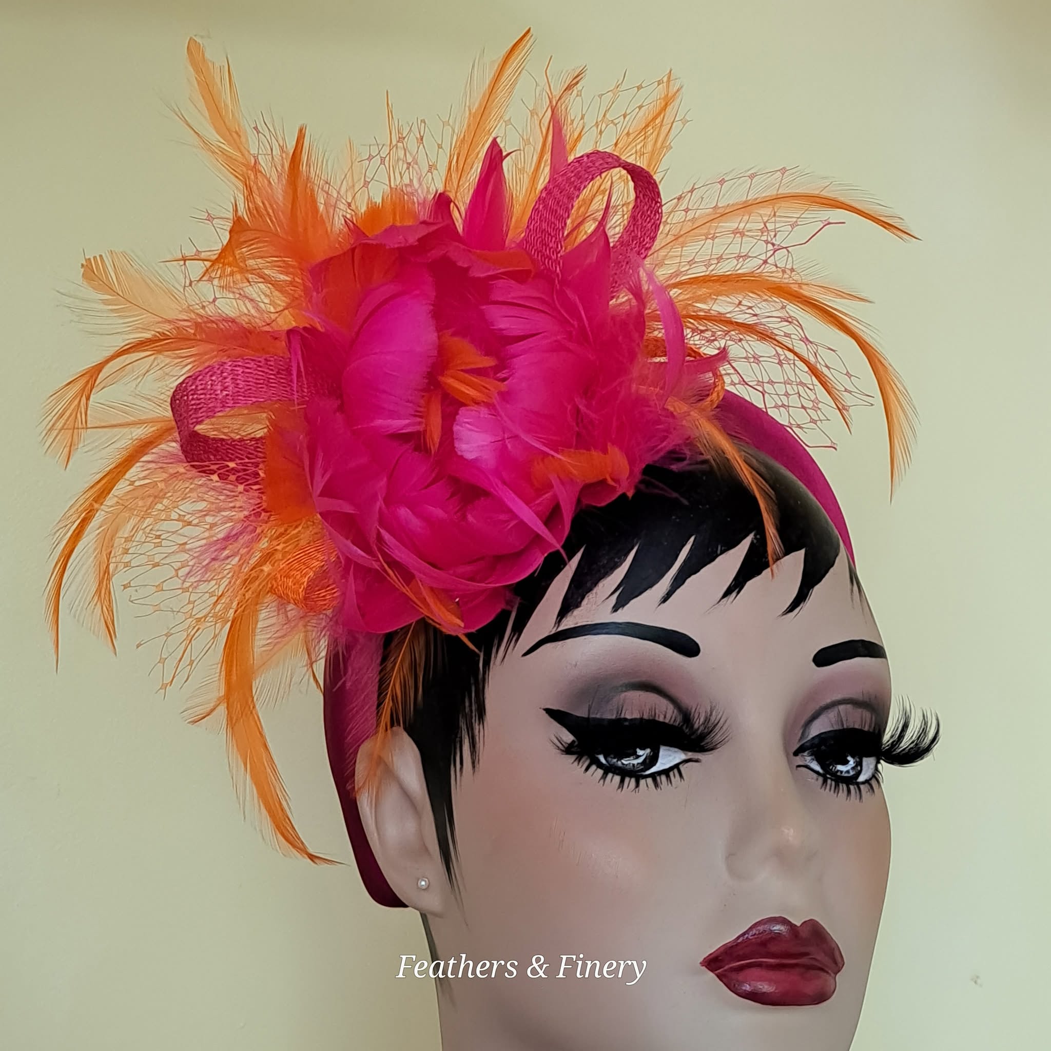 Fuchsia feathered fascinator hat